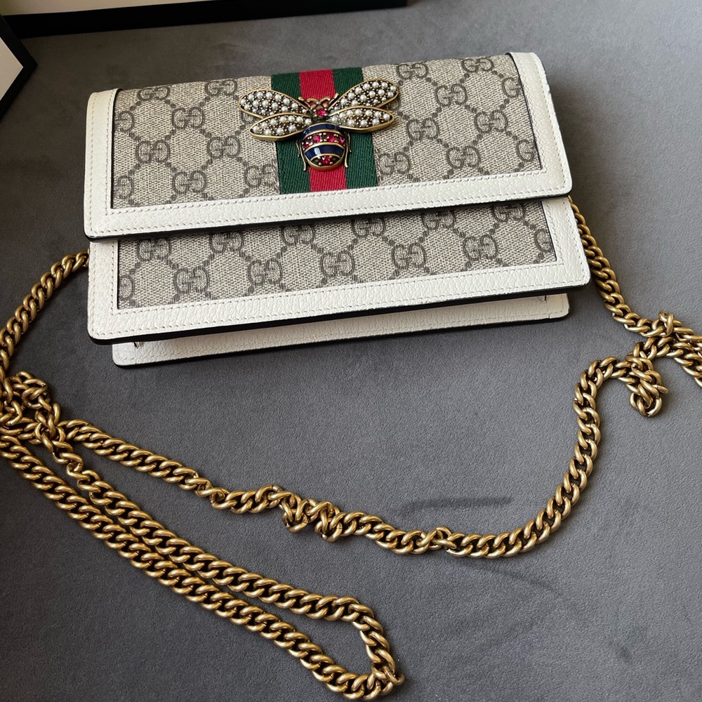 Gucci beige GG supreme canvas and leather web queen Margaret wallet on chain.